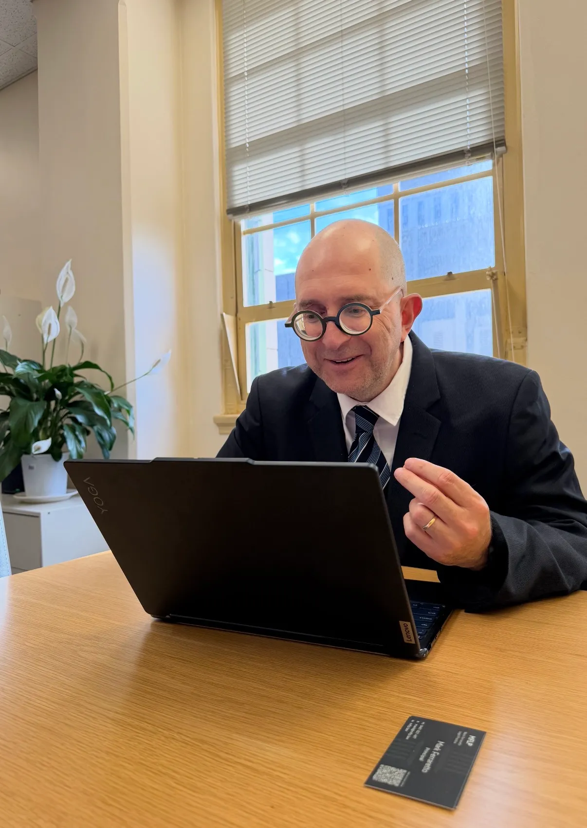 Mark Ferraretto at his desk with a laptop